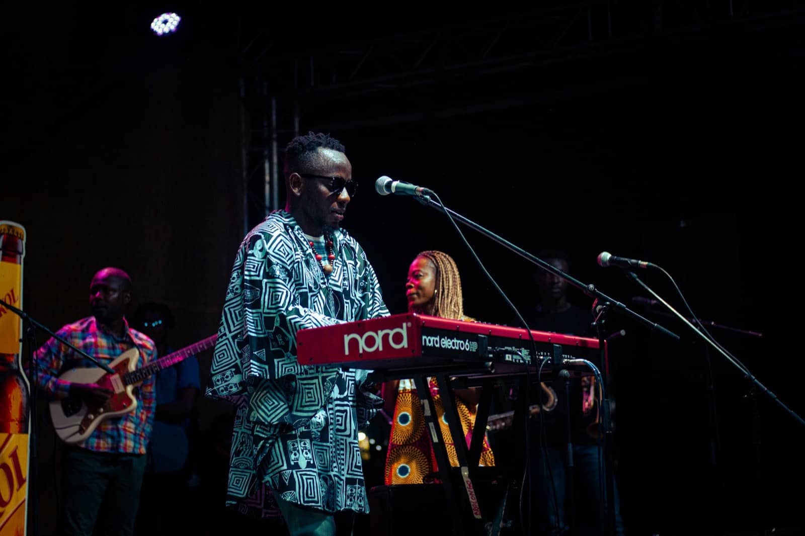 Musician playing keyboards on stage